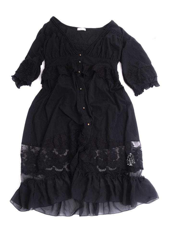 Black dress with lace details on a white background