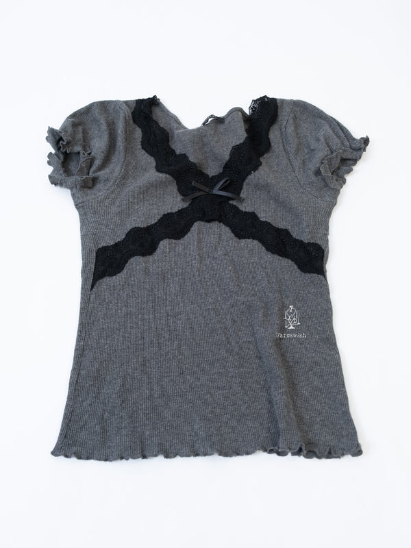 Grey ribbed knit top with black lace cross panels and short sleeves.