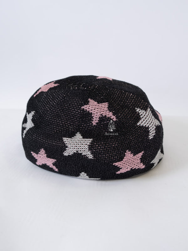 Black knit beret with pink and grey star motifs.