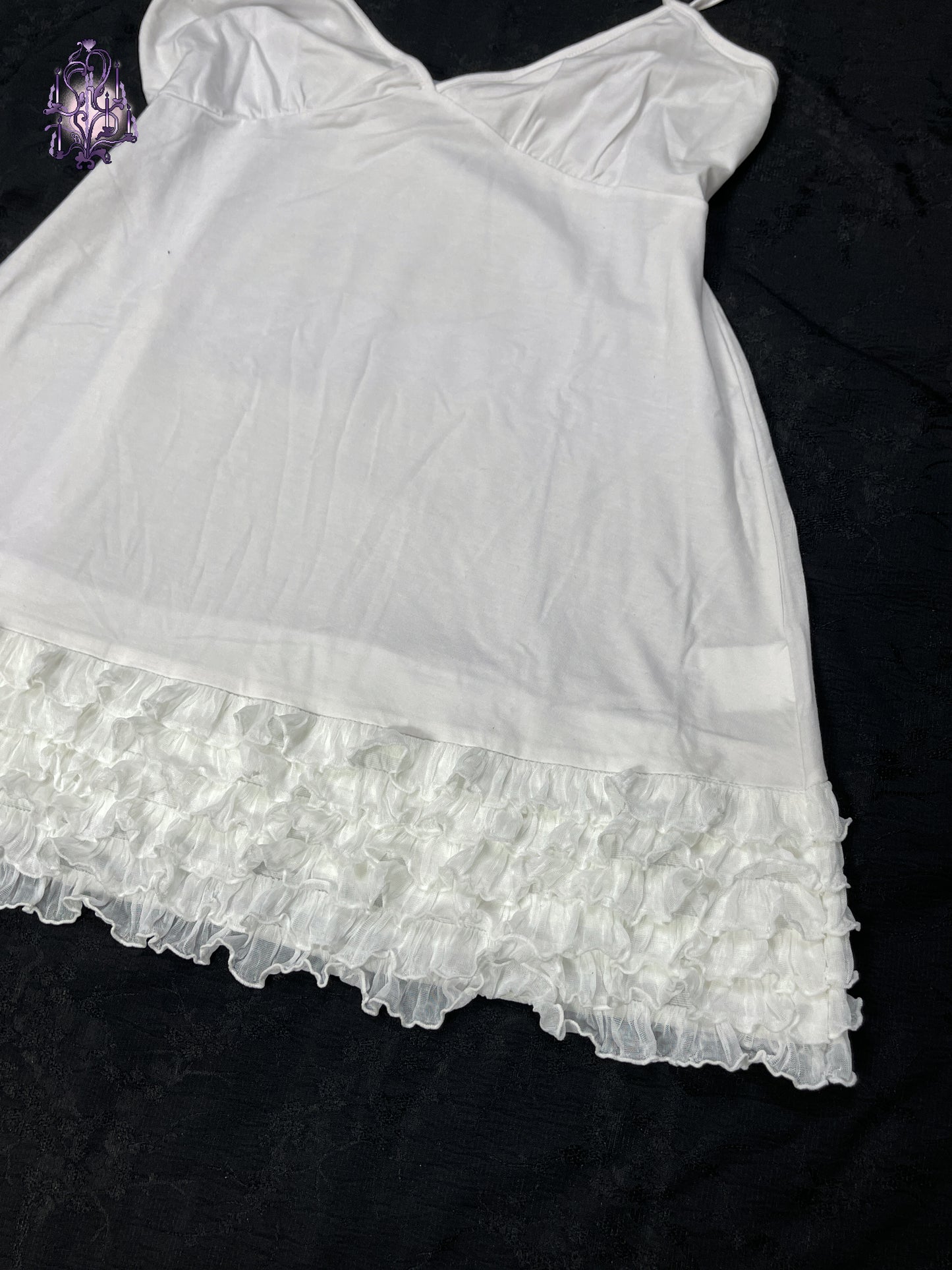 Ruffle hem white camisole