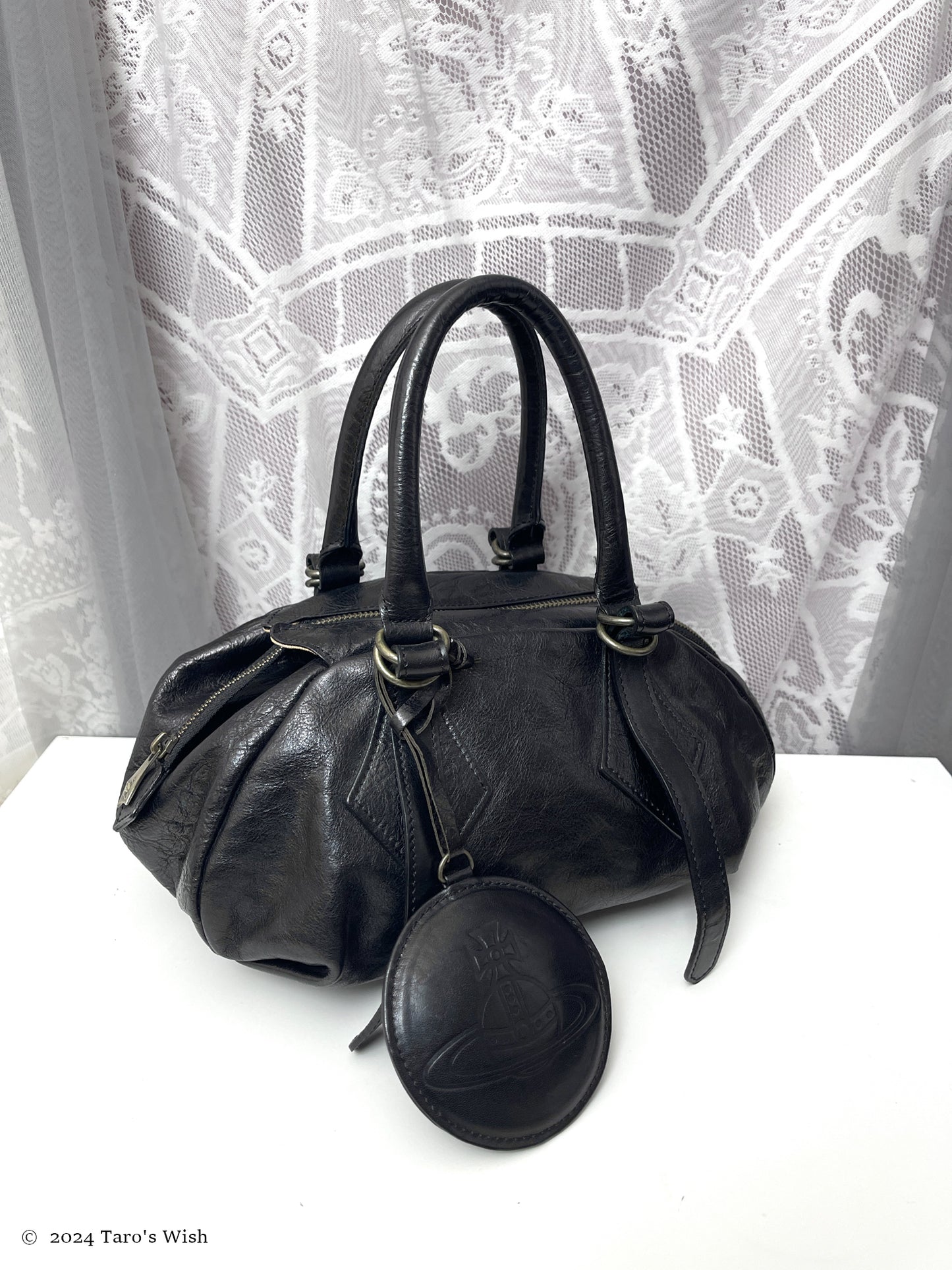 genuine leather boston bag with large orb pendant, japanese label vivienne westwood