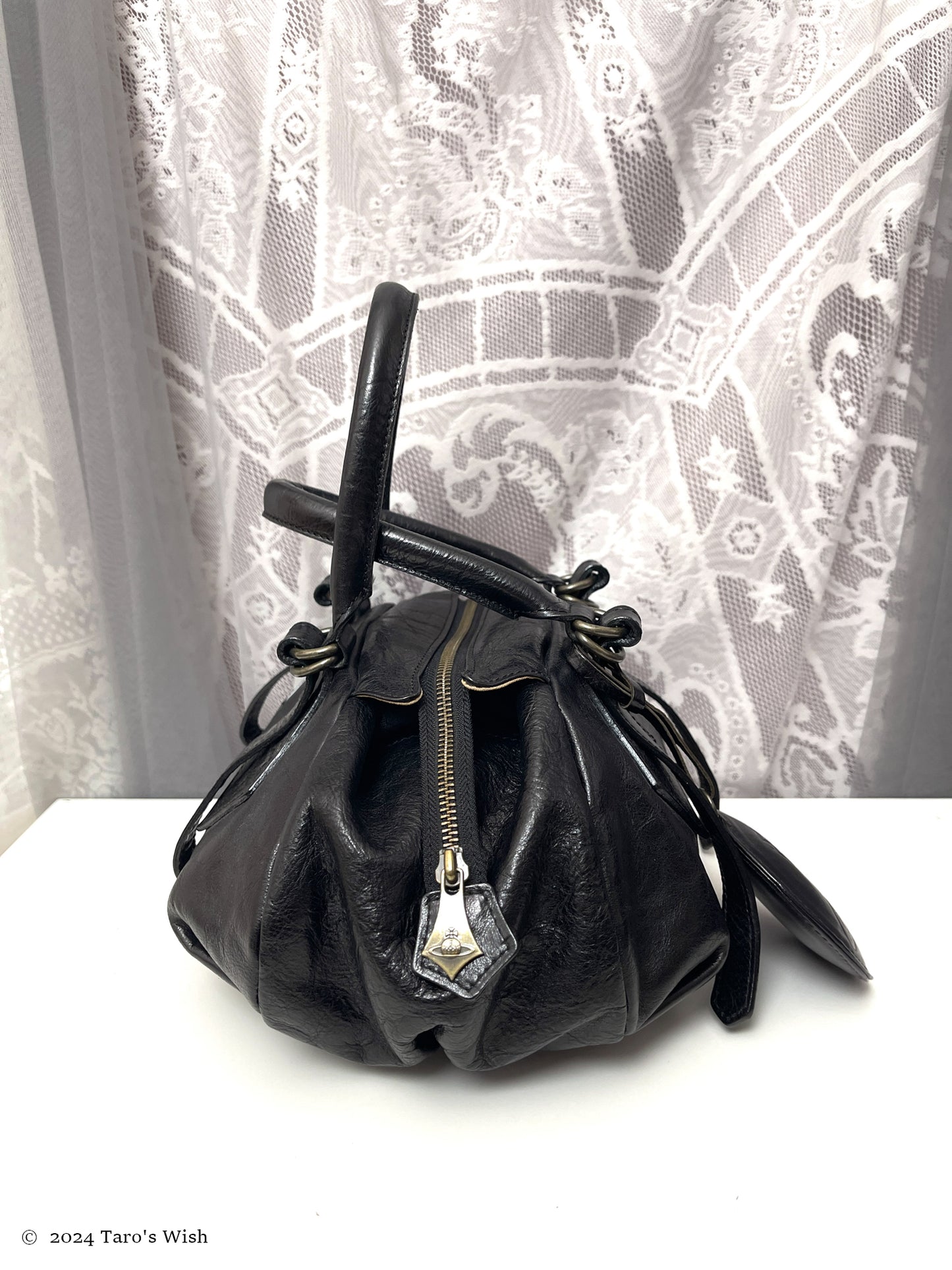 genuine leather boston bag with large orb pendant, japanese label vivienne westwood