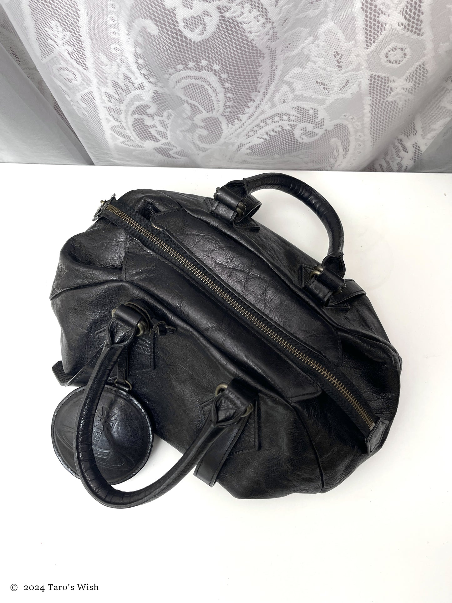 genuine leather boston bag with large orb pendant, japanese label vivienne westwood